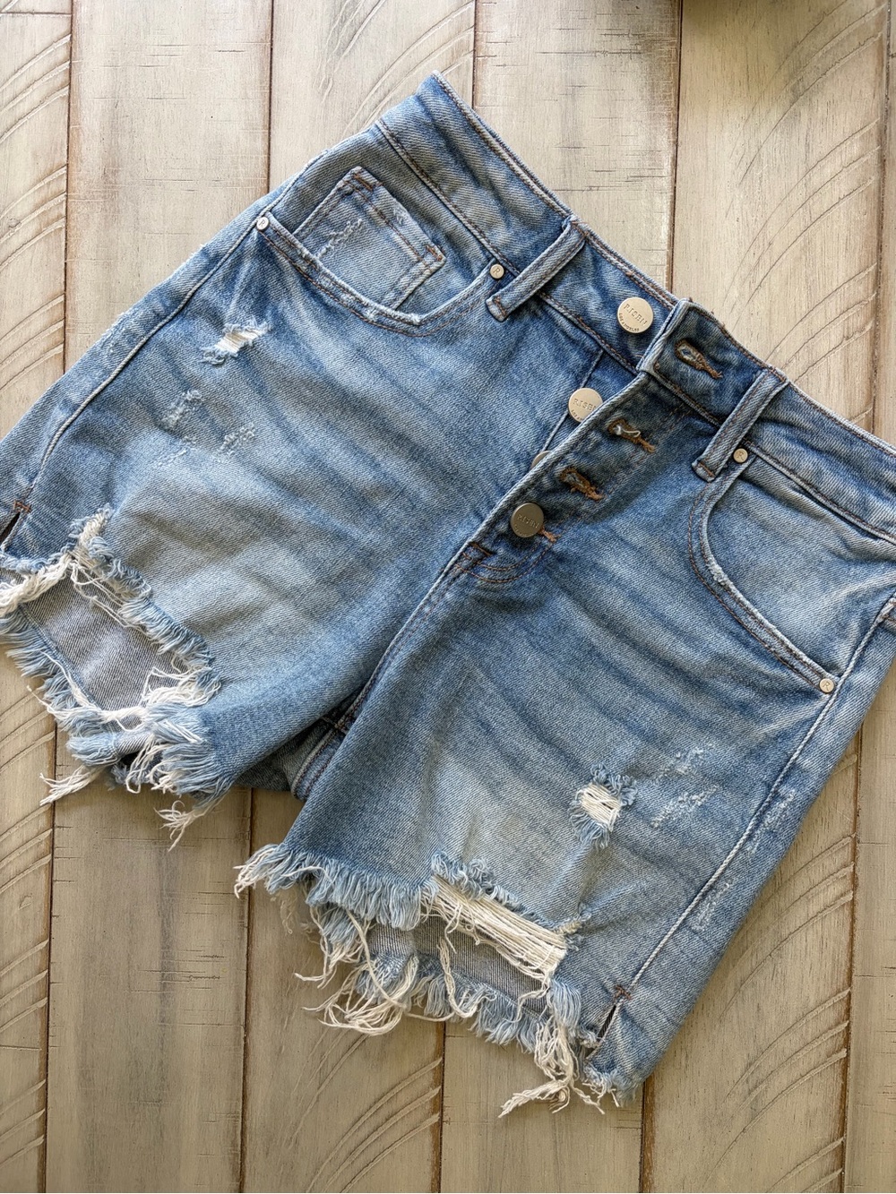 High-Rise Light Blue Distressed Denim Shorts